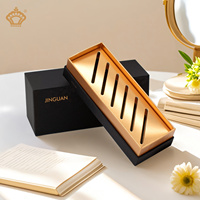 Boîte cosmétique de luxe minimaliste de qualité supérieure estampée de feuille d'or en relief UV rigide de couleur or noir emballage personnalisé fait à la main