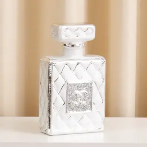 Hot Selling Modern Luxury Tabletop Decor Home Decoration Pieces Bright Silver Carving Ceramic Perfume Bottle Ornament