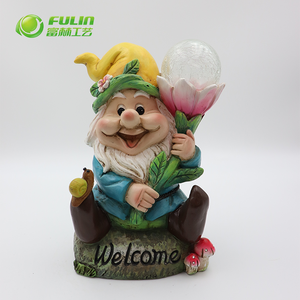 Outdoor Life Size Dwarf Elf Figurine Resin Solar Gnome Light Statue Stting on a Welcome Stone with a Lit Tulip for Garden Decor