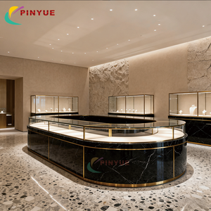 เคาน์เตอร์โลหะกระจกหรูหราทันสมัย เคาน์เตอร์<span class=keywords><strong>ร้าน</strong></span>ค้าปลีกแบบกำหนดเอง ออกแบบตกแต่งภายในร้านขายเครื่องประดับ ตู้โชว์เครื่องประดับทรงกลมกระจก - Product Image 1