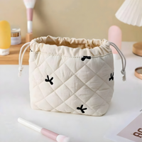 Pochette cosmétique écologique matelassée avec broderie de nœuds et fermeture éclair pour cosmétiques, accessoires capillaires, bijoux et petits essentiels quotidiens