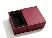 Boîte cadeau rigide à tiroir coulissant de luxe, surface à motif de feuilles en relief, insert en mousse EVA noire personnalisé pour l'emballage de parfums et de cosmétiques