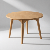 Table de cuisine ronde moderne avec pieds en bois massif, barre transversale renforcée et structure de support triangulaire, style minimaliste
