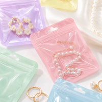100 pièces/sac Sachets holographiques en Mylar à fermeture éclair pour bijoux, poudres, aliments secs, noix, bonbons, emballage irisé