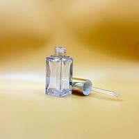 Nouvelle conception, flacon d'huile essentielle rectangulaire en PETG à paroi épaisse de 20 ml, flacon compte-gouttes pour l'emballage cosmétique et l'aromathérapie