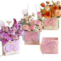 Boîte cadeau florale de luxe faite à la main, portable et pliable, avec motif floral et estampage sur papier couché pour le transport des fleurs