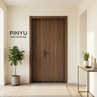Armoire en bois massif avec cadre en laiton et verre cannelé vertical en noyer foncé, pour chambre, dressing, cuisine, ou comme porte intérieure de séparation.