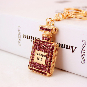 Botella de <span class=keywords><strong>Perfume</strong></span> con diamantes de imitación para hombre y mujer, llavero de aleación, accesorios, colgante, llavero, dijes - Product Image 5