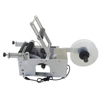 Machine d'étiquetage semi-automatique MT-50 pour bouteilles rondes, idéale pour l'étiquetage des autocollants.