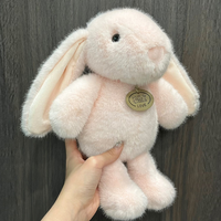Peluches lapins à longues oreilles Kawaii en coton, jouets en gros pour machines à griffes d'arcade et designs personnalisés