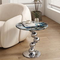 Table basse moderne en pierre frittée avec structure en acier inoxydable argenté – Design durable, écologique et pratique pour votre salon