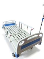Lit médical manuel à manivelle unique pour hôpital avec tête de lit perforée en ABS, roulettes silencieuses et support de bassin