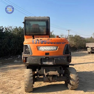 Excavatrice sur pneus d'occasion pas chère Doosan DX60W, capacité de godet 0,2 m³, pour travaux routiers - Product Image 1