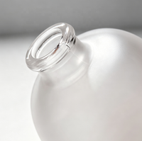 Vente en gros de bouteilles en verre ovales givrées de 300 ml pour jus, thé et boissons