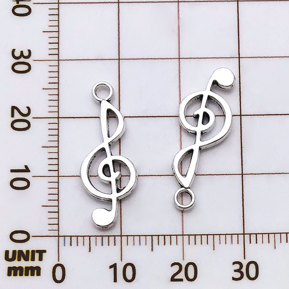 Une note de musique antique en argent - 0,8g - 10*25mm - 5619