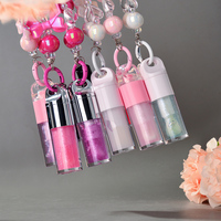 Vente en gros de rouge à lèvres liquide de luxe à haute pigmentation, gloss à lèvres hydratant, huile à lèvres repulpante brillante avec porte-clés, marque privée