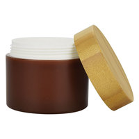 Frasco de ámbar esmerilado de plástico ecológico de 50g y 150g con tapa de bambú para lociones