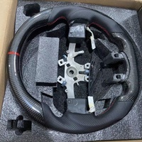 Les volants en fibre de carbone en cuir de style sportif personnalisés conviennent aux accessoires d'intérieur de voiture Dodge Ram 1500 2500 3500