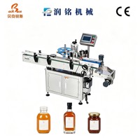 Machine d'étiquetage entièrement automatique à alimentation par rouleaux pour confiture de myrtilles, aliments en conserve et bouteilles de boissons