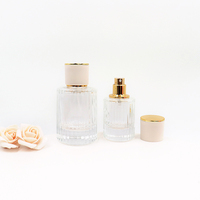 Vente en gros de flacons de parfum en verre pour femmes vides et rechargeables de forme ronde de 30ml 50ml 100ml avec boîte