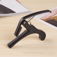 Capo de guitare en alliage de zinc de haute qualité Meilleur capo de requin acoustique pour instruments à cordes Échantillon gratuit disponible
