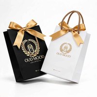 Sac de shopping recyclable en papier couché avec logo imprimé sur feuille d'or, style classique, pour emballage de maquillage, avec poignée à cordon et ruban