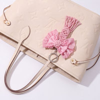 Pendentif de sac en corde perlée avec nœud rose doux pour sac à main, porte-clés, accessoire