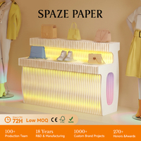 Présentoir pliable et extensible en papier Spazepaper pour poterie colorée, avec éclairage, pour magasin de détail