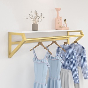 Colgador Dorado de Pared y Estante Lateral <span class=keywords><strong>para</strong></span> Tiendas de Ropa Infantil y Femenina - Exhibidor Multifuncional - Product Image 1