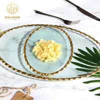 Assiette en verre transparente faite sur commande écologique de chargeur de vaisselle de forme ovale de service de restaurant décoratif avec la jante d'or
