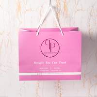 Sacs en papier à poignée en ruban pour emballage, sacs cadeaux de luxe personnalisés avec logo pour boutique de cosmétiques et vêtements, couleur rose