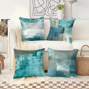 Абстрактные бирюзовые декоративные подушки украшают уютную гостиную, дополненные праздничными носочками и декором в виде оленьих рогов. - Product Image 2