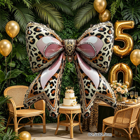 Ballon en Mylar géant rétro à motif léopard avec nœud, idéal pour la décoration de fête d'anniversaire de cowgirl ou comme toile de fond photo.