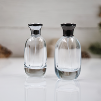 Vente en gros de bouteille de parfum plate en verre de 100ml couvercle en alliage de zinc boîte-cadeau personnalisée diffuseur sérigraphie manipulation de surface de gel