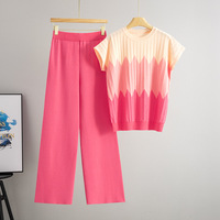 Ensemble coordonné en tricot pour femme, style luxe discret, pull sans manches côtelé et pantalon palazzo, collection boutique été