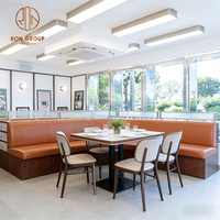 Table et chaise de restaurant rapide, canapé et banquette en marbre carré moderne, avec cadre en bois et revêtement en cuir, pour café.