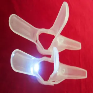 single use vaginal speculum that includes a built in Light Source