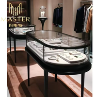 Vitrina de Vidrio Templado con Cerradura MASTER, Ovalada, 135*55*101cm, Marco Negro, Vitrina de Vidrio para Joyería, Centros Comerciales y Kioscos