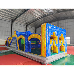 Parcours d'obstacles gonflable géant en PVC pour parcs d'attractions, avec toboggan et mur d'escalade, idéal pour les jeux sportifs et les événements de plein air. - Product Image 2