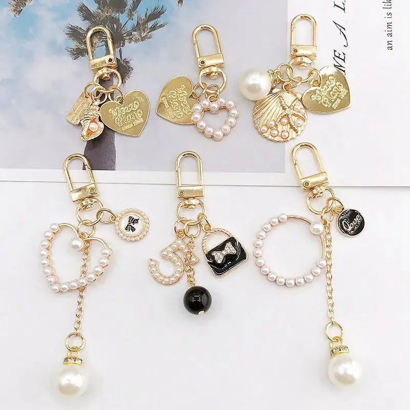 Corazón encantador conchas venta al por mayor de moda de lujo de cristal de diamantes de imitación en forma de Metal llavero anillo de llave