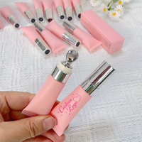 Baume à lèvres en gros aux peptides, gloss repulpant longue durée, végétalien et sans cruauté, avec applicateur de massage métallique en tube souple