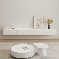 Table basse ronde de salon au design artistique de luxe, ensemble table basse et meuble TV en bois simple pour appartement moderne