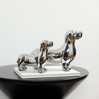Statue de chien en céramique argentée, sculpture minimaliste de teckel, ornement décoratif artisanal pour étagère de maison ou de bureau