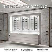 Comptoir de présentation de lunettes optiques en acier inoxydable avec éclairage LED pour magasin de vente au détail de lunettes moderne