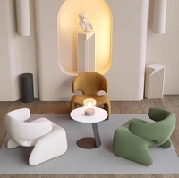 Combinaison moderne de table à thé et de chaises rondes tuftées pour le balcon de l'hôtel Chaise à bascule élégante de loisirs Design