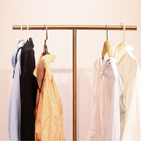 Présentoir de magasin de vêtements argent or Type de sol cintre enfants tissu présentoir Rail