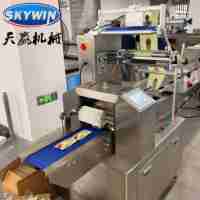 Nouvelle ligne d'emballage entièrement automatique pour biscuits avec machine à sandwichs à la crème pour boulangerie, haute productivité, acier inoxydable 304