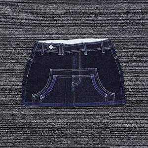 Jupes courtes européennes et américaines de haute qualité Mini <span class=keywords><strong>jupe</strong></span> d'été <span class=keywords><strong>en</strong></span> <span class=keywords><strong>jean</strong></span> pour femmes de couleur unie personnalisée - Product Image 4