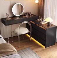Bureau de toilette moderne noir avec plateau en verre, éclairage LED intégré, plusieurs tiroirs et armoire latérale pour chambre à coucher