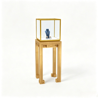 Ensemble de vitrines de présentation de bijoux de luxe sur mesure, en acier inoxydable doré et en verre, pour les bijouteries haut de gamme